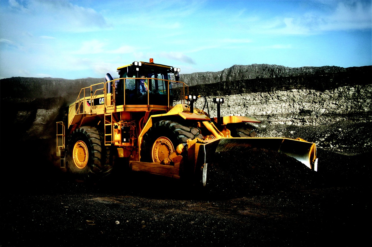 Heavy construction equipment operating at industrial site