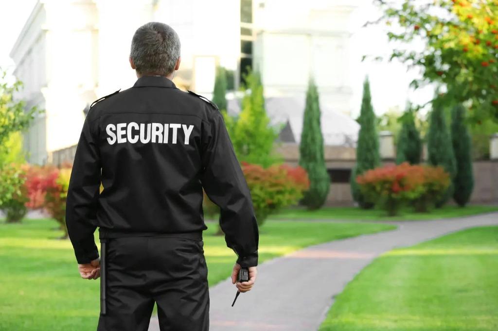 Professional security guard patrolling residential property – Yellowstone Security Services